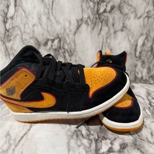 Nike Air Jordan 1 Mid Black and Orange Sneakers